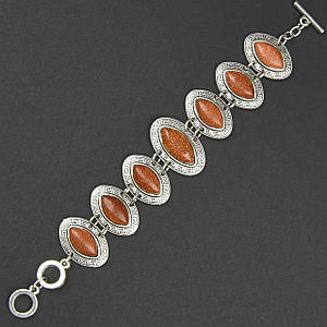 Браслет жіночий сріблястого кольору з сяйним рутиловим кварцом застібка тогл довжина 22 см ширина 30 мм