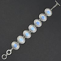 Браслет жіночий сріблястого кольору з місячними камінчиками та візерунками застібка тогл довжина 22 см ширина 23 мм