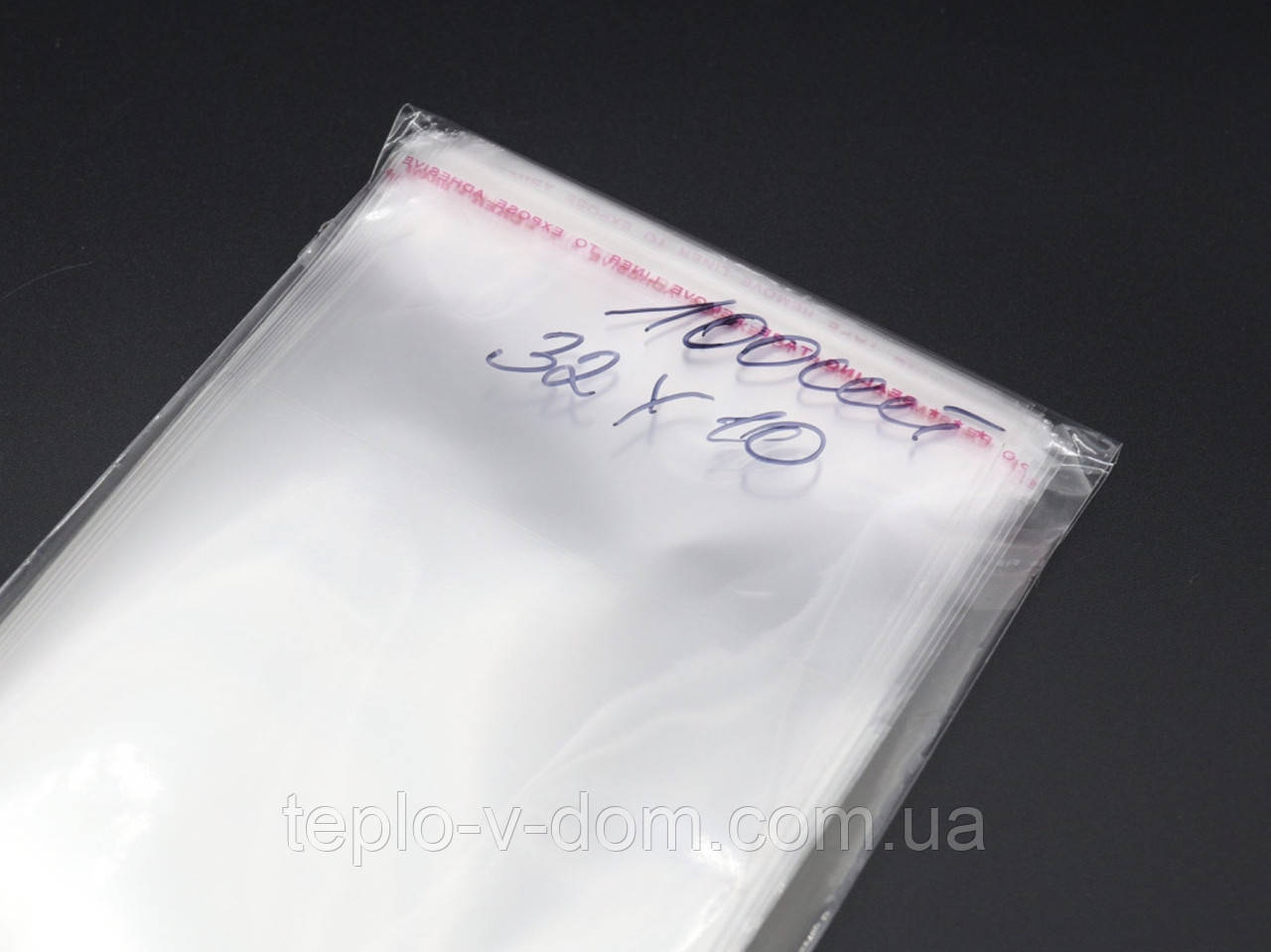 Пакувальні пакети зі скотч клапаном без друку 32х10см 25мкм 100шт/уп в закритому вигляді - 27х10см прозорі