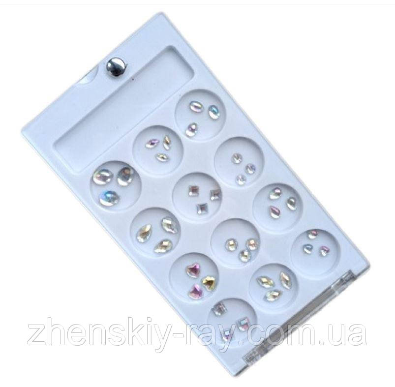 Набір стразиків різних розмірів і форм для нігтів у контейнері