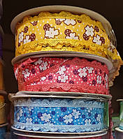 Стрічка 2.5 см ажурна з малюнком "клевер" кольорова (1моток=20ярд)