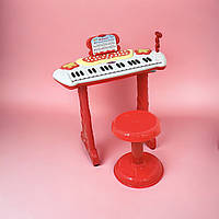 Дитяче піаніно-синтезатор на ніжках з мікрофоном Electronic Piano 883, стільчик, підсвітка, запис звуку, звукові ефекти, червоний