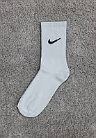 Носки высокие подростковые хлопковые спортивные с логотипом Nike белые