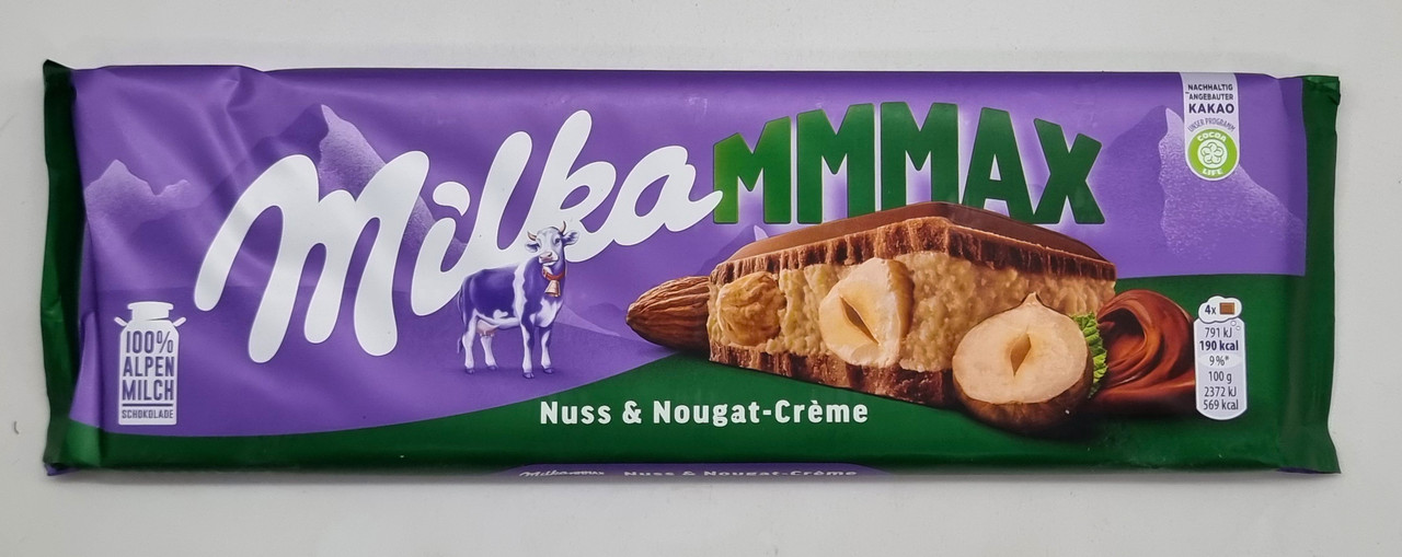 Молочний шоколад Milka Nuss & Nougat-Creme Горіхи та крем-нуга 300 г