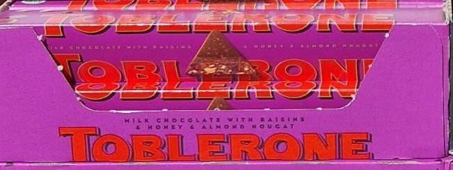 Шоколад Toblerone молочний з родзинками і нугою 100g, Швейцарія