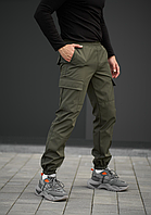 Модні демісезонні штани карго з бічними кишенями хакі на гумці