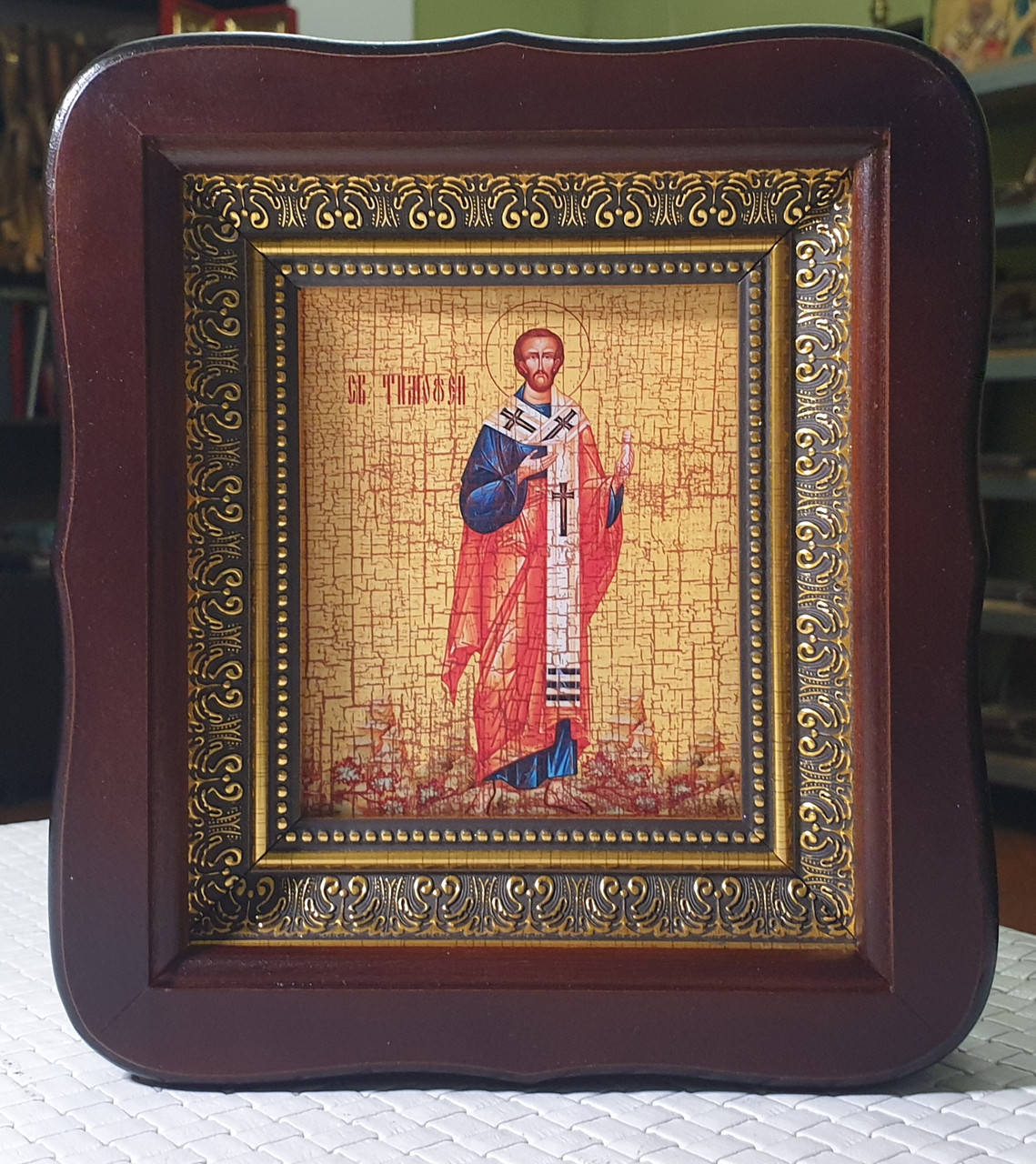 

Икона Святой Апостол Тимофей в темном фигурном деревянном киоте под стеклом, размер киота 20×28, лик 10*12