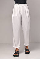 Женские стильные укороченные молочные брюки с отворотом