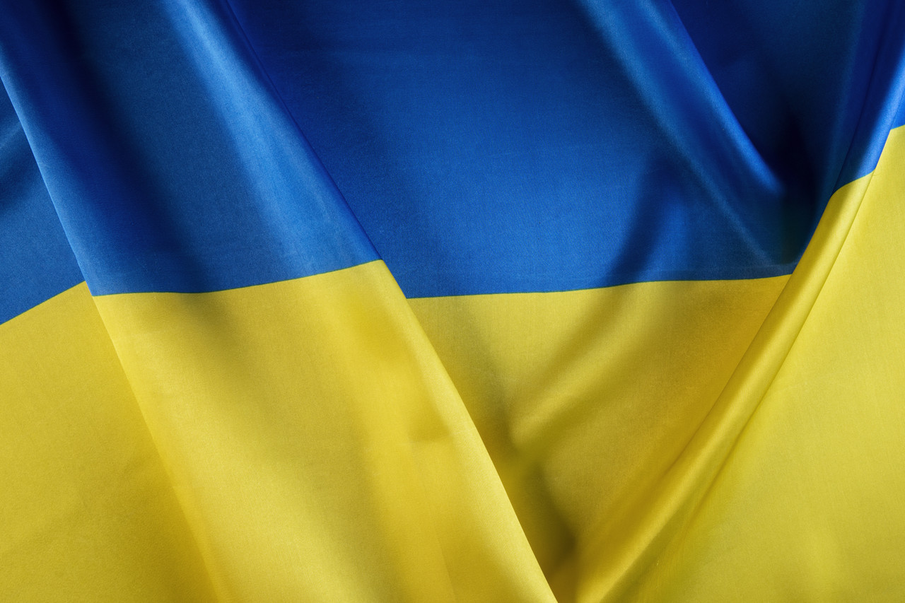top_view_folded_ukranian_flag_still_life.jpg