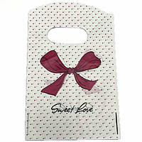 Пакет поліетиленовий подарунковий білого кольору з рожевим горошком і бантиком розмір 15х9 см паковання 50 штук