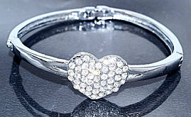 Браслет. Родій. Камені: білий циркон. Діаметр: 6 см. Ширина: 15 мм.