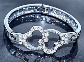 Браслет. Родій. Камені: білий циркон. Діаметр: 6 см. Ширина: 20 мм.