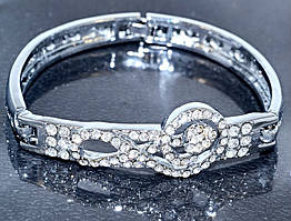 Браслет. Родій. Камені: білий циркон. Діаметр: 6 см. Ширина: 15 мм.