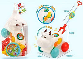 KMD05 Каталка корівка з ручкою музична в сітці 19,5*14*16