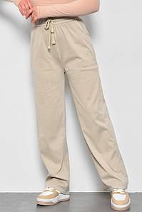 Штани жіночі розкльошені напівбатальні бежевого кольору 173437P