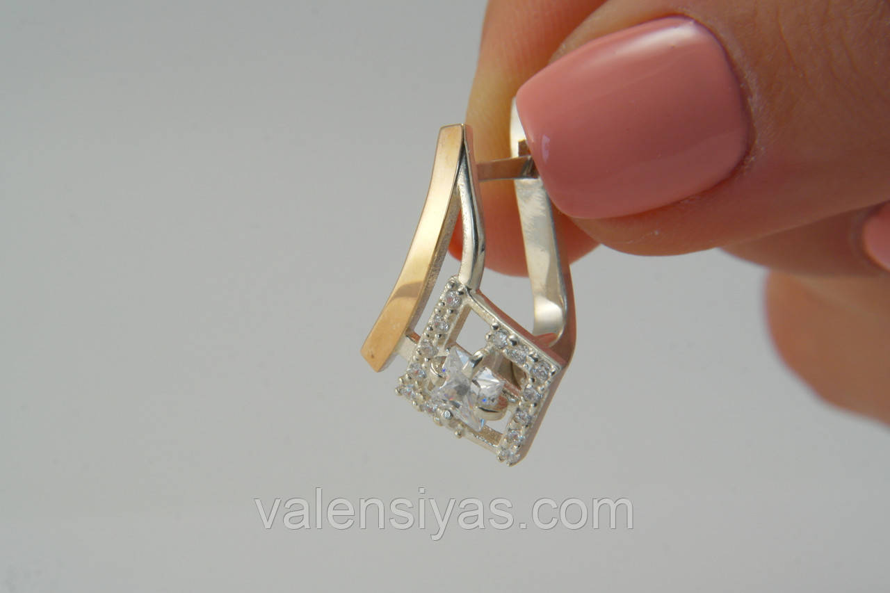 Гарні жіночі сережки із золотом і цирконіями