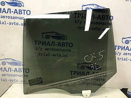 Скло дверей заднє ліве Mazda