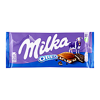 Молочний шоколад Milka зі шматочками печива Oreo 100 г Мілка Орео