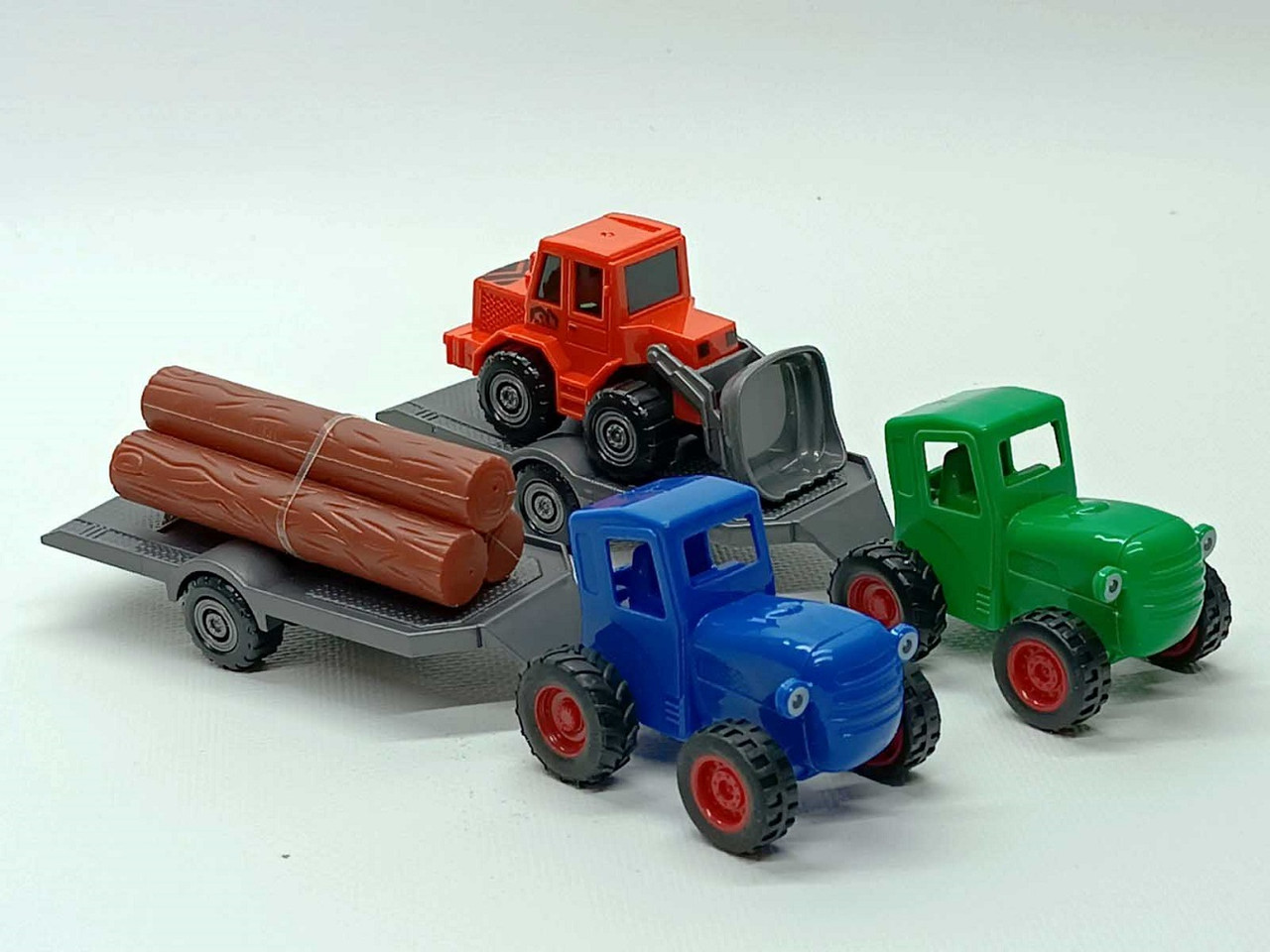 Ігровий набір Star toys "Синій трактор" 19 см із причепом 145326