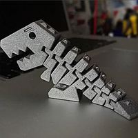 Игрушка Дино Рекс напечатана на 3D-принтере.