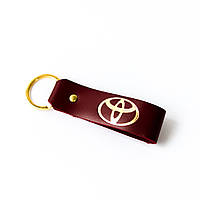 Брелок-петля з логотипом авто "Toyota" бордо з позолотою.