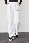 Трикотажні штани на флісі з накладними кишенями — молочний колір, L (є розміри)
