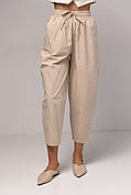 Жіночі штани-банани з кишенями — бежевий колір, M (є розміри)