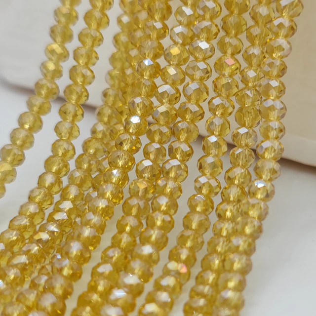 Бусины хрустальные (Рондель) 8х6 мм приблизительно 68 бусин цвет светлое золото  с АБ