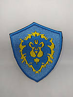 Шеврон нарукавная эмблема Світ шевронів World Of Warcraft Alliance 72×92 мм Сине-желтый TE, код: 7826472
