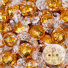Шоколадні цукерки Lindt Lindor Orange з апельсином, ваги, фото 4