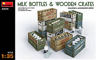 Молочные бутылки с ящиками