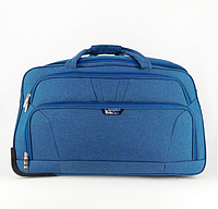 Невелика сумка на колесах CANNES міцна дорожня текстильна синя сумка на двох колесах з видвижною ручкою