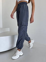 Жіночі стильні штани карго з резинками-стяжками та накладними кишенями по боках