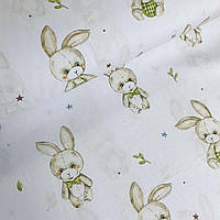 Хлопковая ткань польская зайчики бежево-серые с зелеными бантиками на белом (E-393)