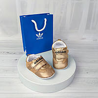 Золотисті пінетки кросівки Adidas для новонароджених