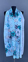 Шифоновый женский шарф 175*65 см голубого цвета с ярким рисунком.