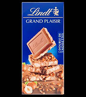 LINDT Grand Plaisir 150g.( В шоколаді поєнується швейцарський шоколад та різних лісових горіхів)