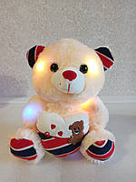 Светящийся и говорящий плюшевый мишка Тедди с сердцем Персиковый 512559And