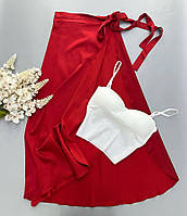 Красная женская легкая однотонная шелковая юбка на запах длины миди