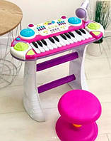 Детский игрушечный синтезатор пластмассовый пианино на ножках на подставке со стульчиком и микрофоном NMS