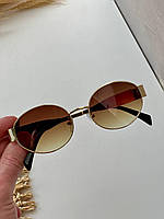Женские солнцезащитные очки овальные в металлической оправе