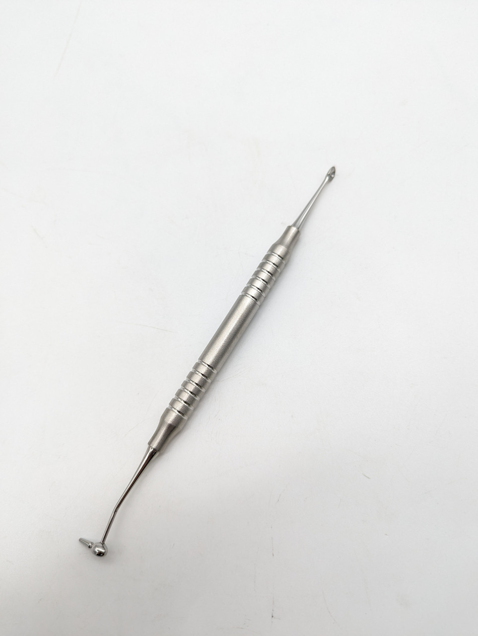 Інструмент для внесення кісткового матеріалу ложечка