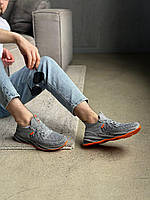 Чоловічі літні сірі кросівки текстильні з оранжевою підошвою