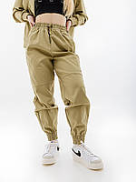 Жіночі Штани Nike W NSW SWSH PANT WVN Хакі XS (7dFD1131-276 XS)