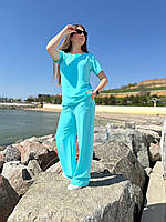 Жіночий прогулянковий літній костюм: блузка-туніка з пояском та прямі штани із жатки, норма та батал