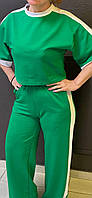 Зеленый женский стильный костюм брючный весенний.