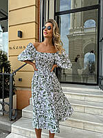 Жіноча романтична легка літня сукня із софту довжини міді з пишним рукавом Колір Білий/Хакі Принт