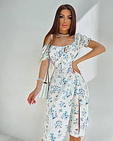 Жіноча елегантна літня сукня з розрізом у квітковий принт: 42-44, 46-48. Колір: білий із блакитними квітами.