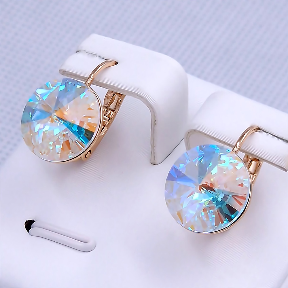 Сережки XР. Позолота 18К. Камені: Swarovski білого бензинового кольору. Довжина: 17 мм. Ширина: 12 мм.