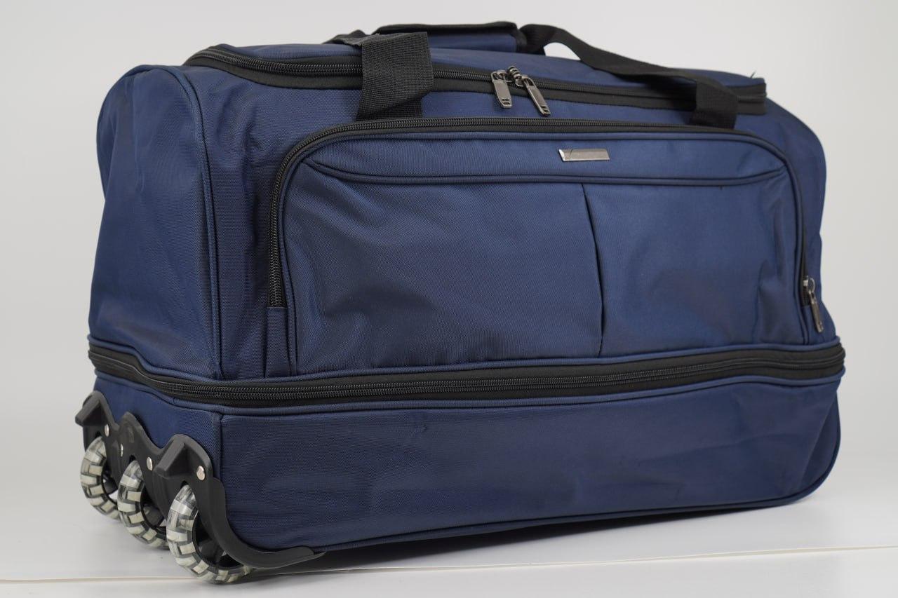 Дорожня сумка на колесах із висувною ручкою синя з розширенням